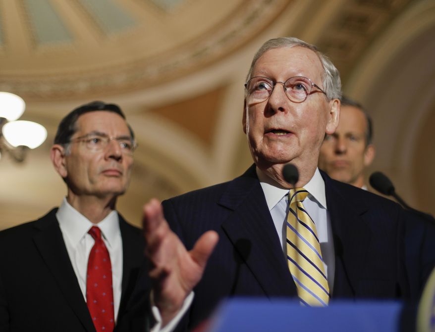 Senate Majority Leader Mitch McConnell of Ky., flanked by, Sen. John Barrasso, R-Wyo., left, and Sen. John Thune, R-S.D., speaks to reporters on Capitol Hill in Washington, Tuesday, May 2, 2017, following a policy luncheon. (AP Photo/Pablo Martinez Monsivais)