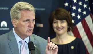 House Majority Leader Kevin McCarthy of Calif., accompanied by Rep. Cathy McMorris Rodgers, R-Wash., speaks with reporters on Capitol Hill in Washington, Tuesday, May 2, 2017, following the Republican Caucus meeting. (AP Photo/Cliff Owen)