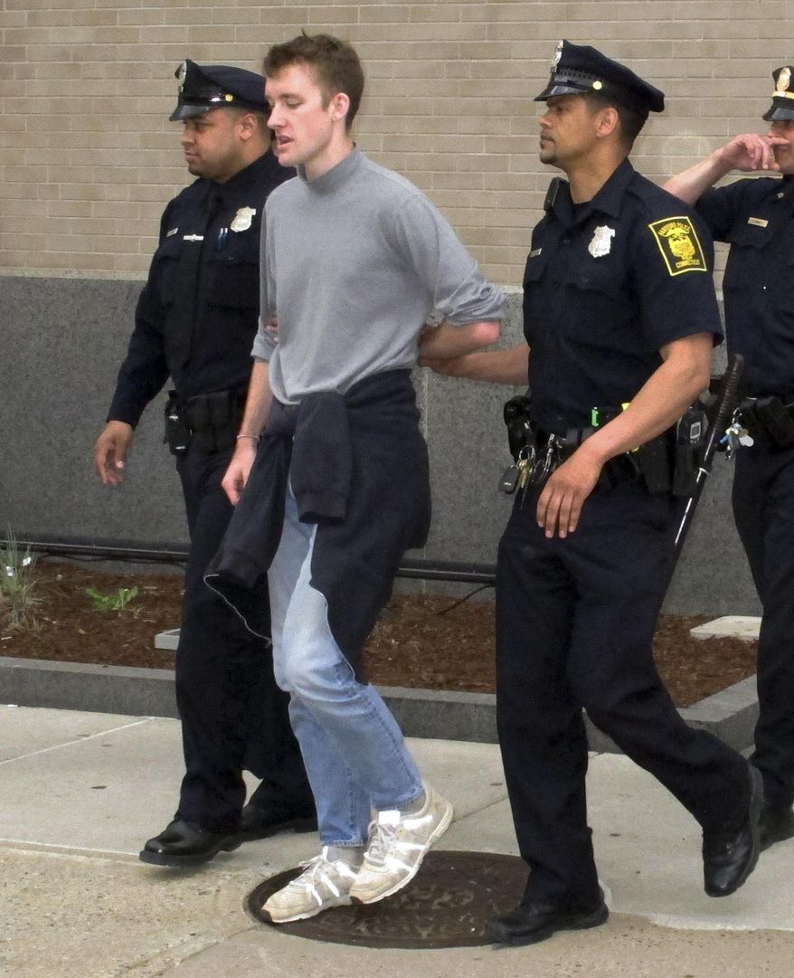 Police lead away one of several demonstrators who had blocked an entrance to the federal court building while protesting Thursday's scheduled deportation of Luis Barrios to his native Guatemala, Tuesday, May 2, 2017, in Hartford, Conn. Barrios, 25, who has no criminal record, fled Guatemala in 1992 and entered the U.S. without legal permission. He lives in Derby, Conn., with his wife and four children, who are U.S. citizens. (AP Photo/Dave Collins)