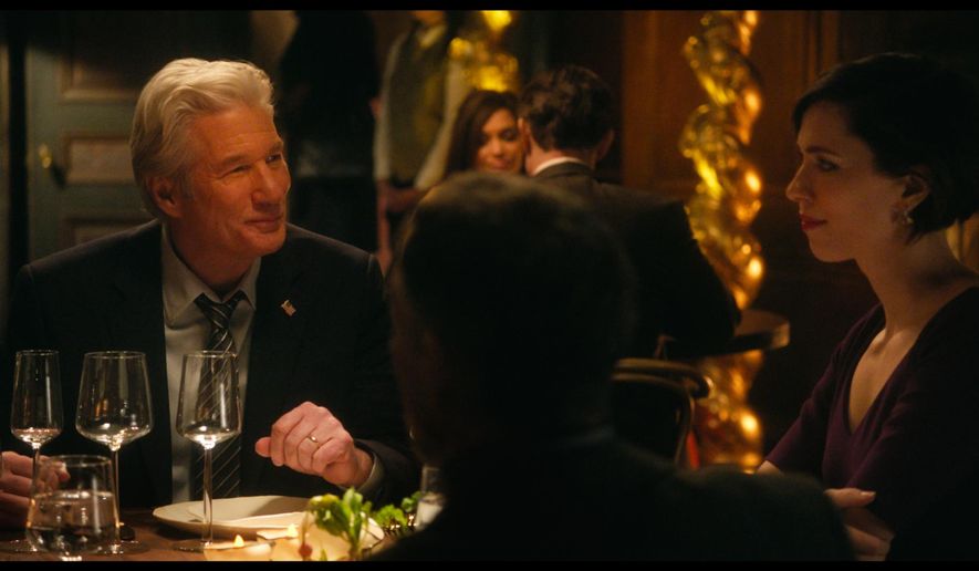 This image released by The Orchard shows Richard Gere, left, and Rebecca Hall in a scene from "The Dinner." (The Orchard via AP)