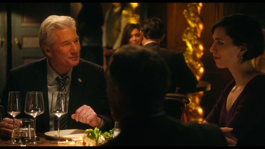 This image released by The Orchard shows Richard Gere, left, and Rebecca Hall in a scene from "The Dinner." (The Orchard via AP)