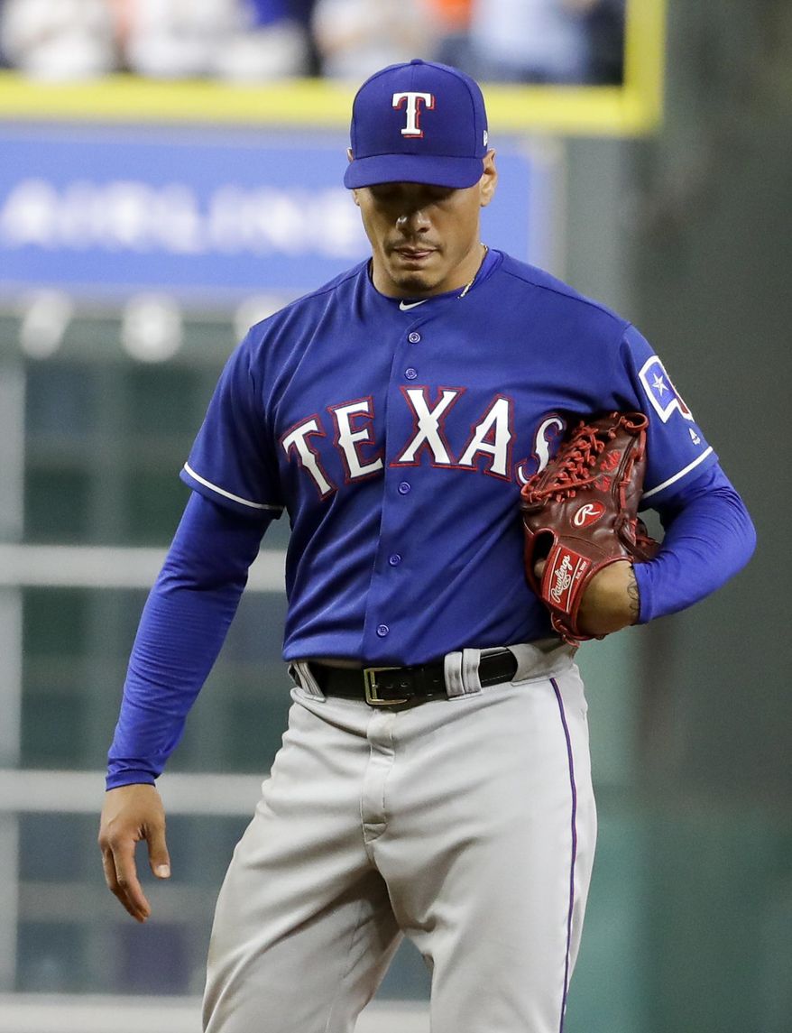 Texas Rangers relief pitcher Keone Kela reacts after giving up a grand slam to Houston Astros' Marwin Gonzalez during the eighth inning of a baseball game, Tuesday, May 2, 2017, in Houston. (AP Photo/David J. Phillip)