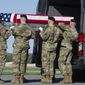 An Army carry team places the transfer case containing the remains of Army 1st Lt. Weston Lee, 25, of Bluffton, Ga., into a transfer vehicle, Wednesday, May 3, 2017, at Dover Air Force Base, Del. According to the Department of Defense, Lee died April 29, in Mosul, Iraq, from injuries while conducting security as part of advise and assist support to partnered forces as part of Operation Inherent Resolve. (AP Photo/Cliff Owen)