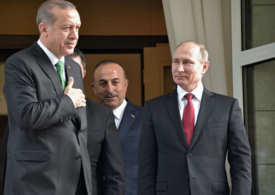 Turkish President Recep Tayyip Erdogan, left, says goodbye to Russian President Vladimir Putin, right, after their meeting in Putin&#39;s residence in the Russian Black Sea resort of Sochi, Russia, Wednesday, May 3, 2017. The presidents of Russia and Turkey held talks on the situation in Syria and also the restoration of full economic ties between their two countries. (Alexei Nikolsky/Sputnik, Kremlin Pool Photo via AP)