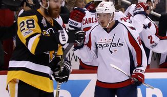 Washington Capitals&#39; Nate Schmidt (88) celebrates his goal as he returns to the bench during the second period of Game 4 in an NHL Stanley Cup Eastern Conference semifinal hockey game against the Pittsburgh Penguins in Pittsburgh, Wednesday, May 3, 2017. (AP Photo/Gene J. Puskar)