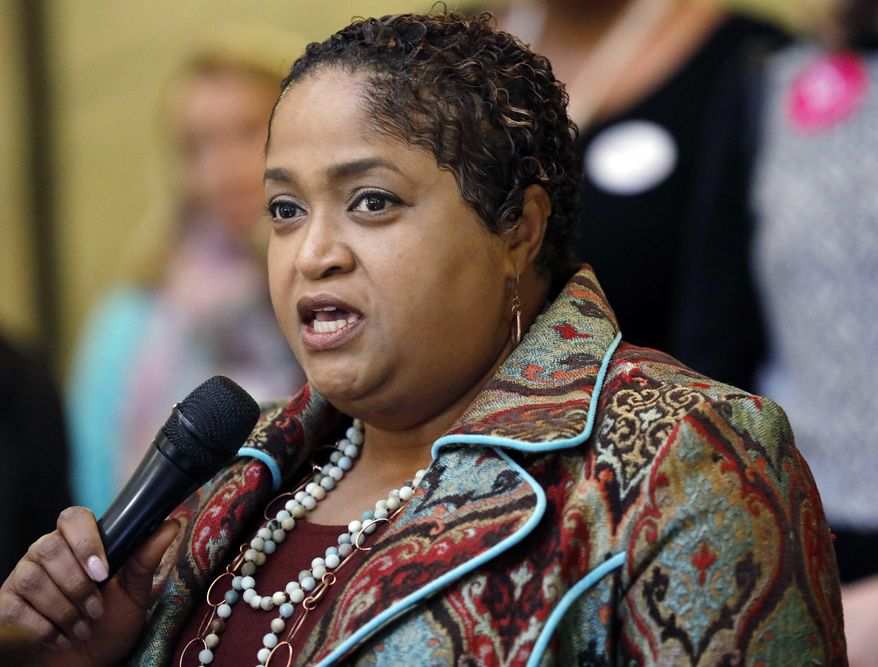 In this March 15, 2017 file photograph, Rep. Sonya Williams-Barnes, D-Gulfport, speaks at a news conference on the gender pay gap at the Capitol in Jackson, Miss. As the Mississippi Legislative Black Caucus chairwoman, Williams-Barnes said Tuesday, May 2, 2017, a number of the state's black legislators say they are boycotting a regional meeting that their own state is hosting this summer, to protest the rebel emblem on the state flag. (AP Photo/Rogelio V. Solis, File)