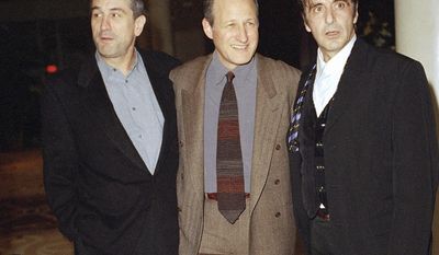 FILE - In this Dec. 6, 1995 file photo, actors Robert De Niro, left, and Al Pacino, right, and film director Michael Mann appear at the world premiere of their film &amp;quot;Heat&amp;quot; at Warner Bros. Studios in Burbank, Calif. Mann’s 1995 opus of driven men and the women who suffer their obsessions comes out on Blu-ray on Tuesday. (AP Photo/Rhonda Birndorf, File)