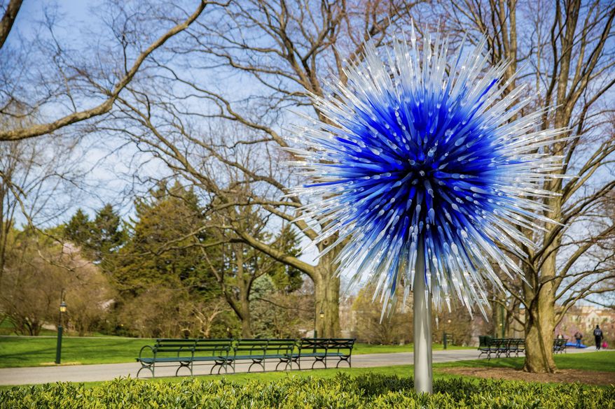 This April 13, 2017 photo provided by the New York Botanical Garden shows Sapphire Star which is part of the Chihuly exhibit at the New York Botanical Garden in New York. The show, titled simply "Chihuly," reveals the evolution of Dale Chihuly's work from 1980 to the present. (New York Botanical Garden via AP)