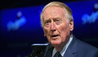 Hall of Fame broadcaster Vin Scully speaks to reporters about being inducted into the Los Angeles Dodgers Ring of Honor, prior to a baseball game between the Dodgers and the San Francisco Giants, Wednesday, May 3, 2017, in Los Angeles. (AP Photo/Mark J. Terrill)