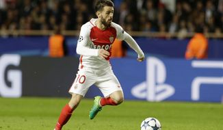 Monaco&#39;s Bernardo Silva goes for the ball during the Champions League semifinal first leg soccer match between Monaco and Juventus at the Louis II stadium in Monaco, Wednesday, May 3, 2017. (AP Photo/Claude Paris)