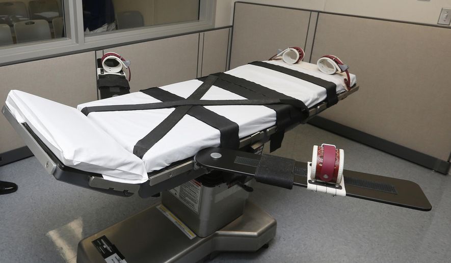 FILE - This Oct. 9, 2014 file photo shows the gurney in the the execution chamber at the Oklahoma State Penitentiary in McAlester, Okla. Oklahoma has had one of the busiest death chambers in the country for decades, executing more people per capita than any other state since the U.S. Supreme Court ruled in 1976 that death sentences could resume. But after a botched lethal injection in 2014 and drug mix-ups in two scheduled executions in 2015, the state is taking a close look at whether executions should resume at all (AP Photo/Sue Ogrocki, File)