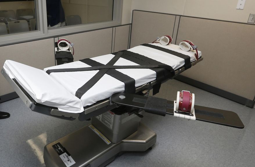 FILE - This Oct. 9, 2014 file photo shows the gurney in the the execution chamber at the Oklahoma State Penitentiary in McAlester, Okla. Oklahoma has had one of the busiest death chambers in the country for decades, executing more people per capita than any other state since the U.S. Supreme Court ruled in 1976 that death sentences could resume. But after a botched lethal injection in 2014 and drug mix-ups in two scheduled executions in 2015, the state is taking a close look at whether executions should resume at all (AP Photo/Sue Ogrocki, File)