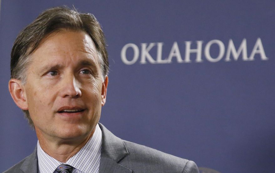 In this April 26, 2017, photo, Mike Hunter, Oklahoma Attorney General, speaks during a news conference in Oklahoma City. Hunter said the state is moving forward with new protocols for executing death row inmates, despite a unanimous recommendation from a bipartisan study group that a death penalty moratorium remain in place. (AP Photo/Sue Ogrocki)