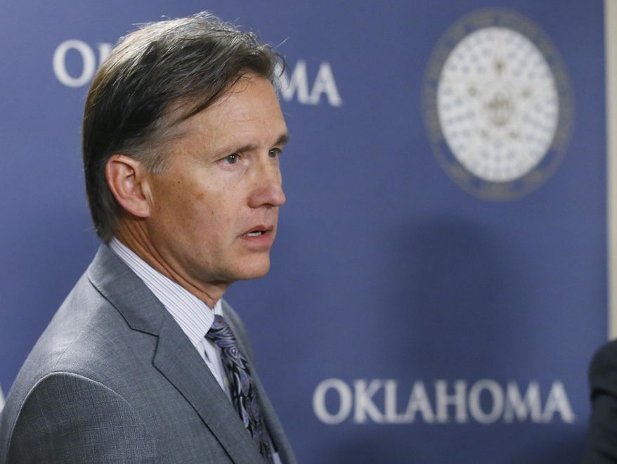 In this April 26, 2017, photo, Mike Hunter, Oklahoma Attorney General, speaks during a news conference in Oklahoma City. Hunter said the state is moving forward with new protocols for executing death row inmates, despite a unanimous recommendation from a bipartisan study group that a death penalty moratorium remain in place. (AP Photo/Sue Ogrocki)