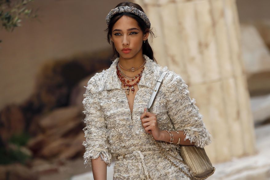 A model wears a creation during the presentation of Chanel Cruise collection in Paris, Wednesday, May 3, 2017. Chanel is hosting its itinerant resort show, destined for glamorous women who sojourn on cruise ships. (AP Photo/Francois Mori)