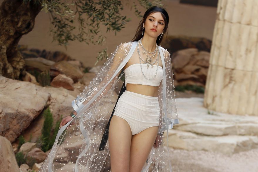 A model wears a creation during the presentation of Chanel Cruise collection in Paris, Wednesday, May 3, 2017. Chanel is hosting its itinerant resort show, destined for glamorous women who sojourn on cruise ships. (AP Photo/Francois Mori)