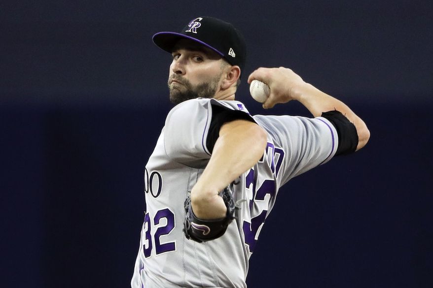 Colorado Rockies starting pitcher Tyler Chatwood pitches to a San Diego Padres batter during the first inning of a baseball game, Tuesday, May 2, 2017, in San Diego. (AP Photo/Gregory Bull)