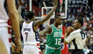 Washington Wizards guard Brandon Jennings (7) and Boston Celtics guard Terry Rozier (12) bump each other after the whistle during the second half in Game 3 of a second-round NBA playoff series basketball game, Thursday, May 4, 2017, in Washington. (AP Photo/Andrew Harnik)