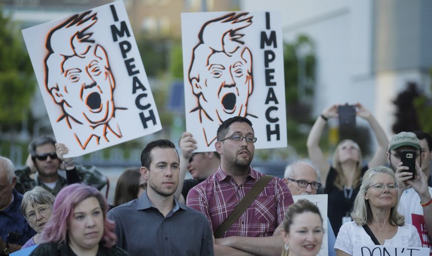 People look on during a health care rally Thursday, May 4, 2017, in Salt Lake City. Utah&#39;s all-Republican House delegation voted Thursday in favor of a health care overhaul that could impact people with pre-existing conditions, triggering serious worries from people who fit that category. (AP Photo/Rick Bowmer)