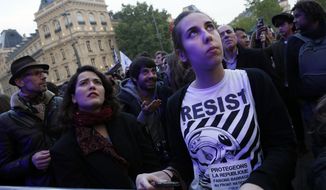 Parisians attended a concert Thursday featuring various artists opposing Marine Le Pen, who faces off in the French presidential runoff Sunday against Emmanuel Macron. (Associated Press)