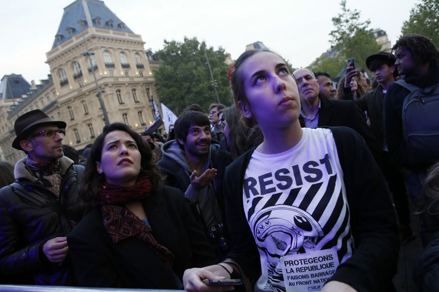 Parisians attended a concert Thursday featuring various artists opposing Marine Le Pen, who faces off in the French presidential runoff Sunday against Emmanuel Macron. (Associated Press)