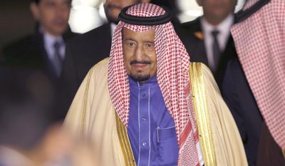 FILE - In this Sunday, March 12, 2017 file photo, Saudi King Salman walks upon his arrival at Haneda International Airport in Tokyo. While the announcement on Thursday, May 4, 2017 of Britain’s Prince Philip’s plan to retire in the fall came as a surprise, for some of the world’s royal families easing out of the public eye is seen as a normal way of ending their public service and handing the reins to a new generation. For others, being a royal really is a job for life. When Saudi King Abdullah died at age 90 in 2015, his then 79-year-old successor Salman had only been crown prince for two and a half years, having outlived brothers ahead of him in line. Within a matter of months, King Salman surprised many in the kingdom by replacing his designated successor with the country’s powerful interior minister and installing his own young son as second-in-line to the throne, bypassing more-experienced royals. (AP Photo/Shizuo Kambayashi, file)