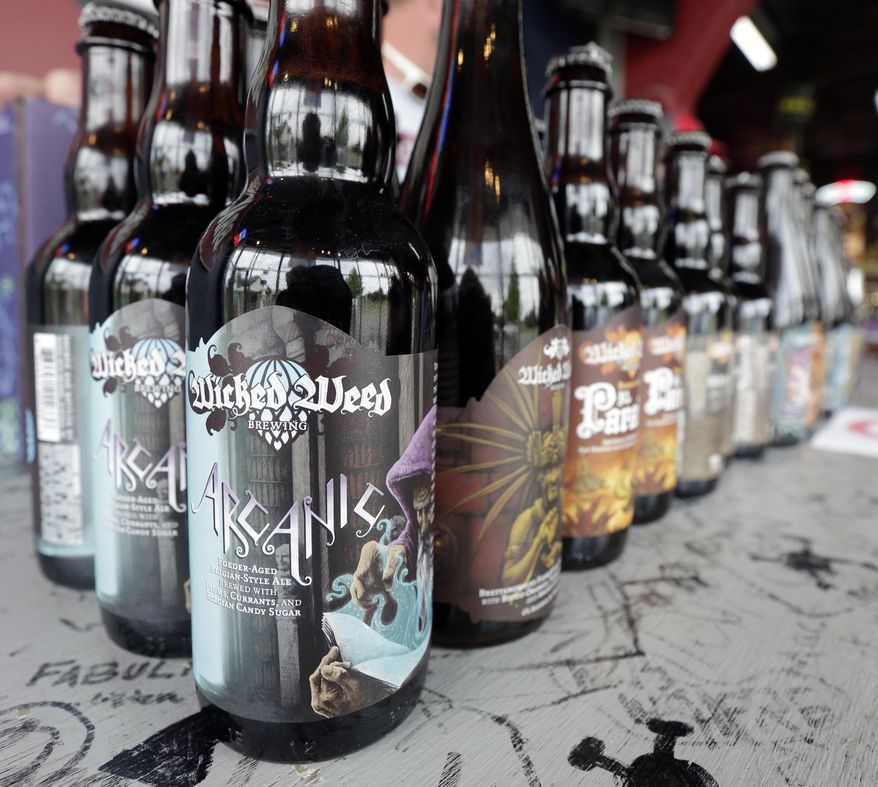 Remaining bottles of Wicked Weed beer are for sale on the bar at Brawley's Beverage in Charlotte, N.C., Thursday, May 4, 2017. Brawley's is among at least a handful of stores or restaurants that announced they don't intend to stock Wicked Weed in the future.(AP Photo/Chuck Burton)