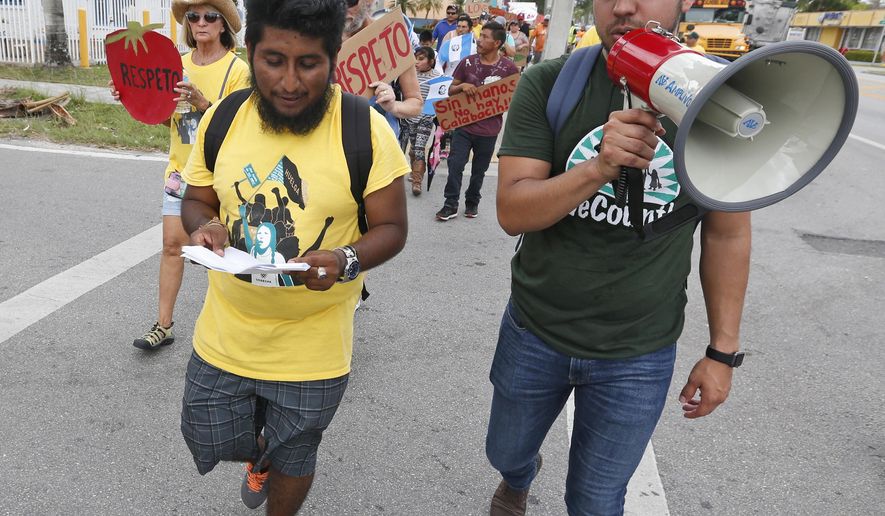 In this Monday, May 1, 2017 photo, Jose Luis Santiago, left, an immigration advocate, marches during a protest march in Homestead, Fla. Cinco de May, a once-obscure holiday marking a 19th Century-battle between Mexico and invading French forces, is being met with ambivalence by Mexican-American and Mexican immigrants.  President Donald Trump’s immigration policies and rhetoric are leaving some Mexican Americans and immigrants feeling at odds with Cinco de Mayo.  (AP Photo/Wilfredo Lee)