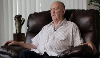 In a photo taken Wednesday, April 26, 2017, former boxer Chuck Wepner talks to The Associated Press in his home in Bayonne, N.J. Forty-two years after he stepped into the ring against Muhammad Ali as a 40-to-1 underdog, Wepner’s business card still has a picture of the moment when he knocked down the champ. Wepner’s life story has now arrived on the big screen with Liev Schreiber playing the Bayonne Bleeder in “Chuck,” which opens on Friday, May 5, 2017, in New York and Los Angeles before expanding nationwide. (AP Photo/Julio Cortez)
