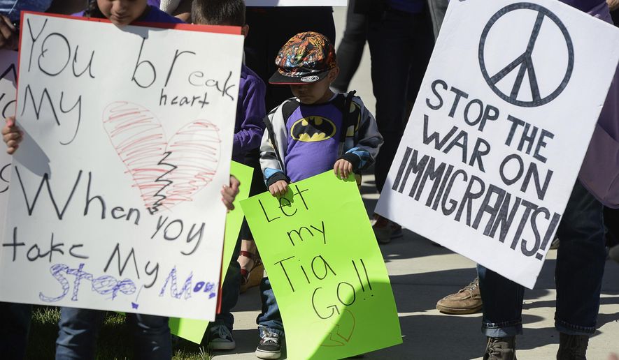 In this May 3, 2017, file photo, Atticus Juarez, 3, nephew of Silvia Juarez, who was detained by ICE agents in a Michaels parking lot last week in front of her 8-year-old daughter, joins family and friends in support of the family in West Valley City, Utah. (Francisco Kjolseth/The Salt Lake Tribune via AP, File)