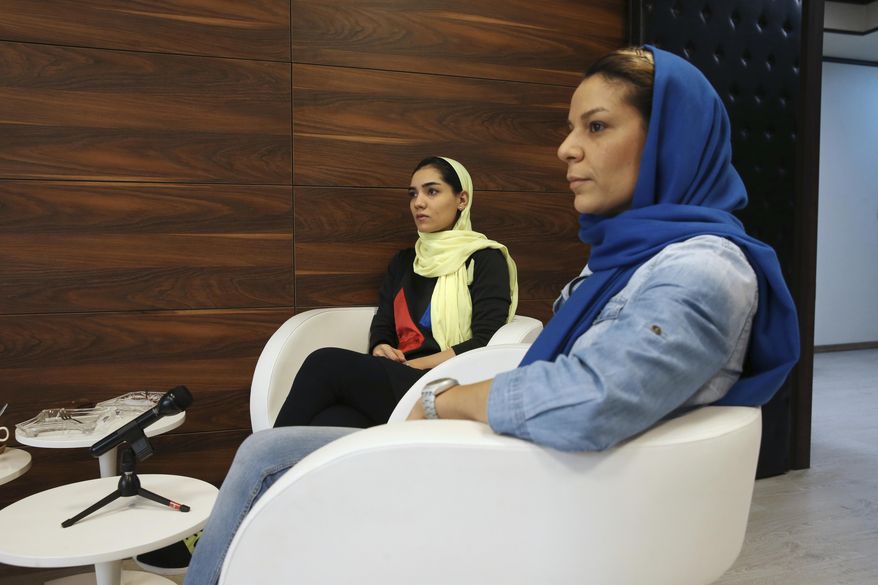 Iranian national basketball team players Shadi Abdolvand, left, and Ayrin Artoonian attend an interview with The Associated Press in Tehran, Iran, Thursday, May 4, 2017. Basketball enthusiasts around the world said a decision to allow players to wear religious headgear in competition will encourage more people to play the sport because it gives participants the right to practice their faith and focus on playing ball. Abdolvand said basketball will change in Iran because younger players will be encouraged to &amp;quot;pursue their goals.&amp;quot; (AP Photo/Vahid Salemi)
