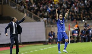 Juventus&#39; Gonzalo Higuain, right, celebrates after scoring as Juventus head coach Massimiliano Allegri gives instructions during the Champions League semifinal first leg soccer match between Monaco and Juventus at the Louis II stadium in Monaco, Wednesday, May 3, 2017. (AP Photo/Claude Paris)