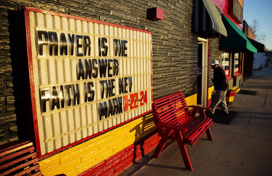 ADVANCE FOR USE MONDAY, MAY 8, 2017 AND THEREAFTER-In this Wednesday, Feb. 1, 2017 photo, a bible message is written on a sign outside a store along the town's business district in Estill, S.C. Most parents in the town have no choice but to send their children to the public schools. More than 90 percent of students at Estill Middle School receive free or reduced lunch. (AP Photo/David Goldman)