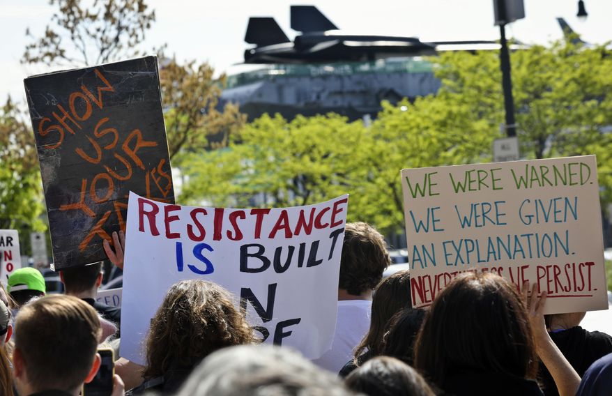 Protesters rally near the Intrepid Air and Sea Museum where President Trump is expected to visit Thursday May 4, 2017, in New York. (AP Photo/Bebeto Matthews)
