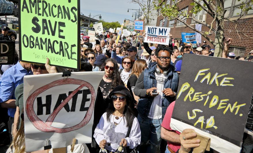 Protesters rally near the Intrepid Air and Sea Museum where President Trump is expected to visit, Thursday May 4, 2017, in New York. (AP Photo/Bebeto Matthews)