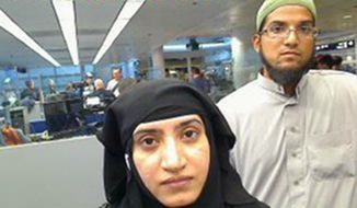 This July 27, 2014, file photo provided by U.S. Customs and Border Protection shows Tashfeen Malik, left, and Syed Farook, as they passed through O&#x27;Hare International Airport in Chicago. Sen. Dianne Feinstein, D-Calif. has said publicly that the FBI paid $900,000 to break into an iPhone of one of the San Bernardino, California, shooters. (U.S. Customs and Border Protection via AP, File)