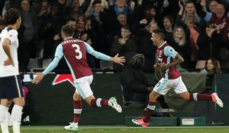 West Ham&#39;s Manuel Lanzini, right, celebrates after scoring during the English Premier League soccer match between West Ham United and Tottenham Hotspur at the London Stadium in London, Friday, May 5, 2017. (AP Photo/Kirsty Wigglesworth)