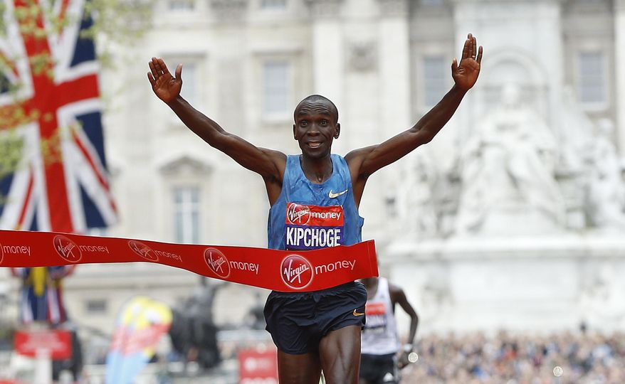 FILE - In this Sunday, April 26, 2015 file photo, Eliud Kipchoge of Kenya wins the Men's race in the 35th London Marathon. On the 63rd anniversary of Roger Bannister breaking the four-minute mile, three elite athletes will attempt to do something arguably more extraordinary, run the first sub-two-hour marathon. Olympic marathon champion Eliud Kipchoge leads the attempt on Saturday, May 6, 2017 at Monza's Formula One racecourse, along with two-time Boston Marathon winner Lelisa Desisa, from Ethiopia, and Eritrean half-marathon world-record holder Zersenay Tadese. (AP Photo/Kirsty Wigglesworth, File)