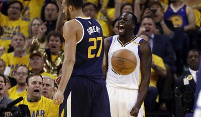 Golden State Warriors&#x27; Draymond Green, right, celebrates after scoring next to Utah Jazz&#x27;s Rudy Gobert (27) during the second half in Game 2 of an NBA basketball second-round playoff series, Thursday, May 4, 2017, in Oakland, Calif. (AP Photo/Marcio Jose Sanchez)