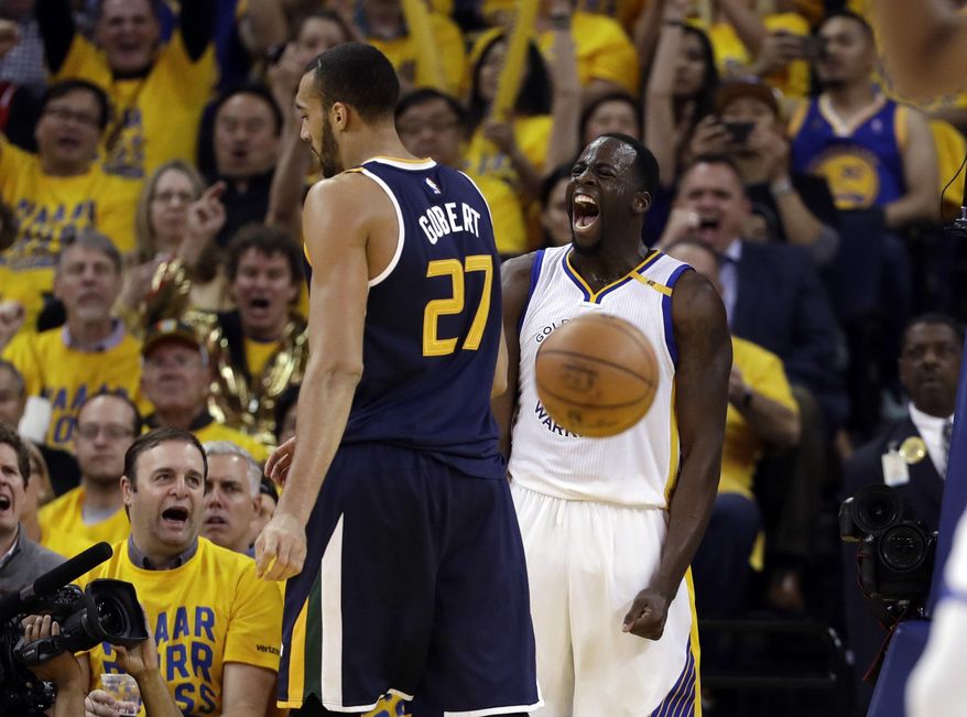Golden State Warriors' Draymond Green, right, celebrates after scoring next to Utah Jazz's Rudy Gobert (27) during the second half in Game 2 of an NBA basketball second-round playoff series, Thursday, May 4, 2017, in Oakland, Calif. (AP Photo/Marcio Jose Sanchez)