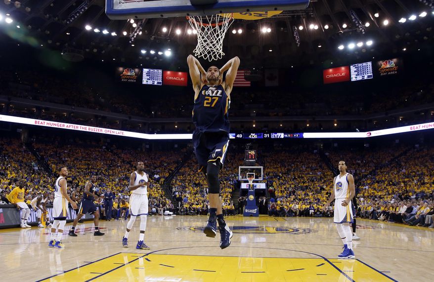 Utah Jazz's Rudy Gobert (27) dunks against the Golden State Warriors during the first half in Game 2 of an NBA basketball second-round playoff series, Thursday, May 4, 2017, in Oakland, Calif. (AP Photo/Marcio Jose Sanchez)