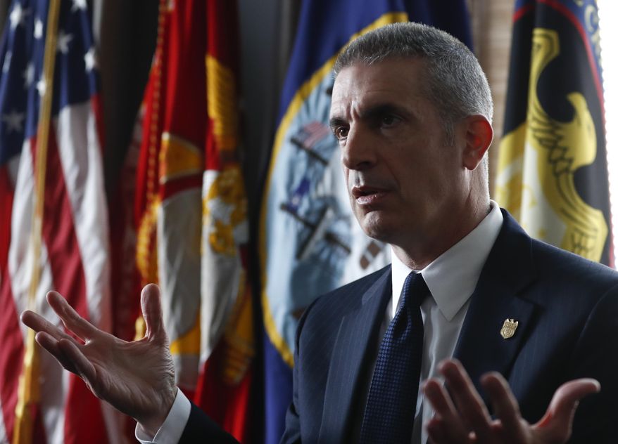 In this photo taken April 19, 2017, Andrew Traver, director of the Naval Criminal Investigative Service (NCIS) speaks during an interview at Marine Corps Base Quantico, in Quantico, Va. In an office at the Marines’ Quantico base outside Washington, about 20 investigators sit elbow to elbow, staring into their computers as images of naked men and women flash across the screens. The objective of all this disturbing sleuth work is to root out the depths of a nude-photo sharing scandal that has rocked the Corps, embarrassed its leaders and spread to other military services. And the sheer weight of the objectionable material is daunting. (AP Photo/Carolyn Kaster)