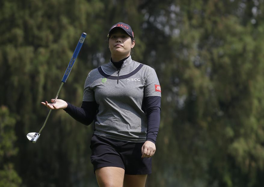 Ariya Jutanugarn, of Thailand, twirls her club as she walks off the 9th hole during round two of the Lorena Ochoa Invitational at Mexico Golf Club in Mexico City, Friday, May 5, 2017. The invitational, the tenth of the 2017 LPGA tour, is the tour's first Match Play event since 2012. (AP Photo/Rebecca Blackwell)