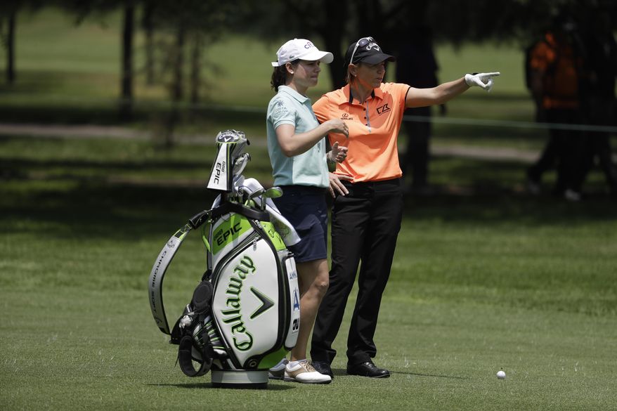 Retired professional golfers Lorena Ochoa of Mexico, left, and Annika Sorenstam, of Sweden, talk on the 2nd hole as they play a practice round ahead of their Hall of Fame exhibition match, during the Lorena Ochoa Invitational at Mexico Golf Club in Mexico City, Friday, May 5, 2017. The invitational, the tenth of the 2017 LPGA tour, is the tour's first Match Play event since 2012. (AP Photo/Rebecca Blackwell)