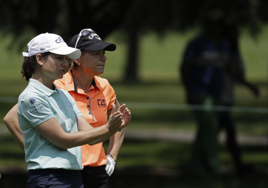 Retired professional golfers Lorena Ochoa of Mexico, left, and Annika Sorenstam, of Sweden, talk on the 2nd hole during a practice round ahead of their Hall of Fame exhibition match at the Lorena Ochoa Invitational at Mexico Golf Club in Mexico City, Friday, May 5, 2017. The invitational, the tenth of the 2017 LPGA tour, is the tour's first Match Play event since 2012. (AP Photo/Rebecca Blackwell)