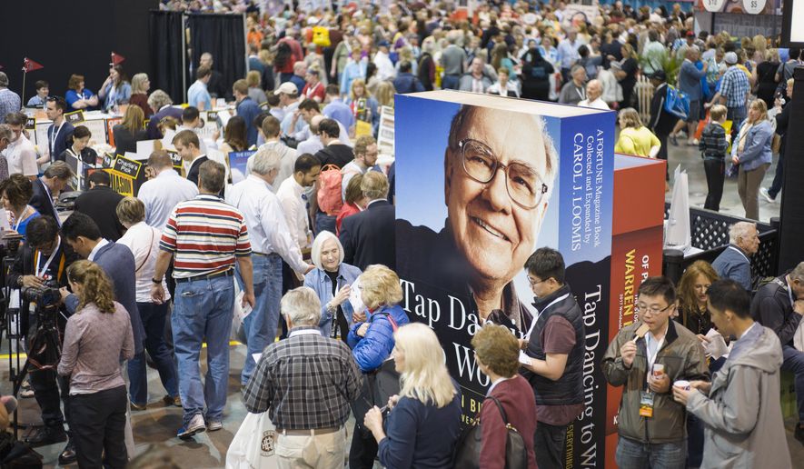 A image of Warren Buffett towers over Berkshire Hathaway shareholders as they visit and shop at company subsidiaries in Omaha, Neb., Friday, May 5, 2017, at the Berkshire Hathaway shareholders meeting. More than 30,000 people are expected to attend the annual meeting, and participate in company-sponsored activities, though the main attraction is CEO Warren Buffett and Vice Chairman Charlie Munger&#39;s Q&amp;amp;A session on Saturday. (AP Photo/Nati Harnik)