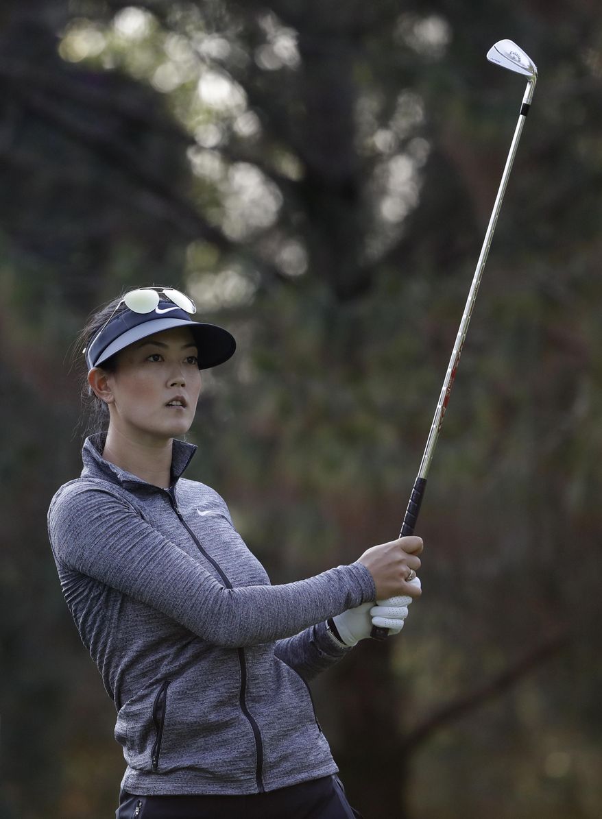 Michelle Wie of the U.S., watches her shot after teeing off on the 3rd hole during round three of the Lorena Ochoa Invitational at Mexico Golf Club in Mexico City, Saturday, May 6, 2017. The invitational, the tenth of the 2017 LPGA tour, is the tour's first Match Play event since 2012. (AP Photo/Rebecca Blackwell)