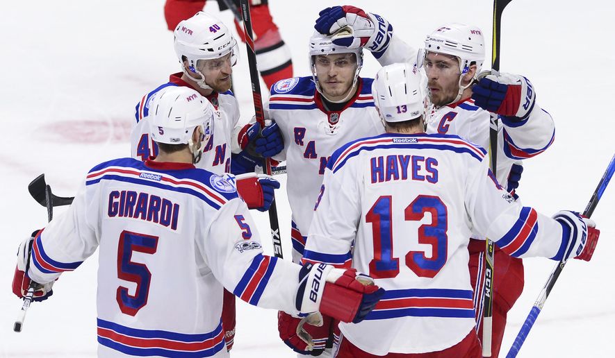 New York Rangers defenseman Ryan McDonagh (27) celebrates his goal with defenseman Dan Girardi (5) right wing Kevin Hayes (13) right wing Michael Grabner (40) and right wing Jesper Fast (19) during the second period against the Ottawa Senators in Game 5 in the second-round of the NHL hockey Stanley Cup playoffs in Ottawa on Saturday, May 6, 2017. (Sean Kilpatrick/The Canadian Press via AP)