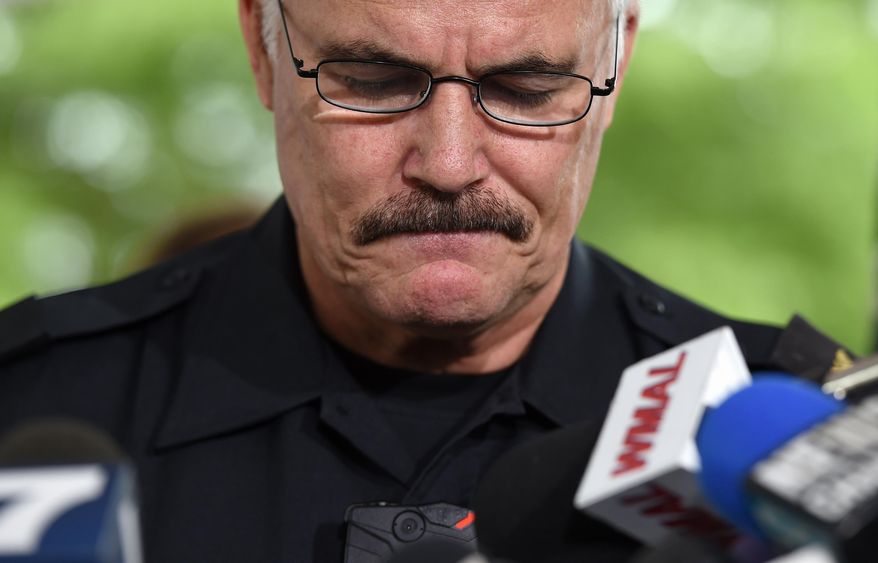 Montgomery County, Md. Police Chief J. Thomas Manger pauses during a news conference in Wheaton, Md., Wednesday, July 15, 2015, to discuss developments in the investigation of the disappearance of 10-year-old Katherine Lyon and 12-year-old Shelia Lyon in 1975. Authorities on Wednesday announced first-degree murder charges against an imprisoned sex offender in the disappearance of two sisters from a suburban Maryland mall in 1975, bringing some clarity to the baffling case that made parents question whether to allow children out of their homes alone. (AP Photo/Molly Riley)