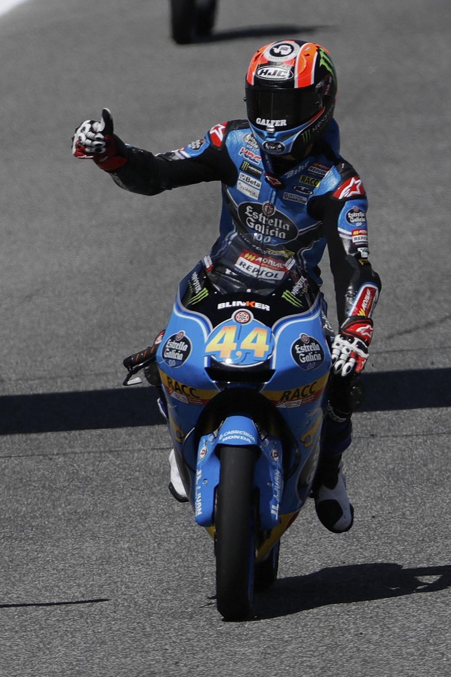 Moto3 rider Aron Canet of Spain gives the thumbs-up as he celebrates his win at the Spanish Motorcycle Grand Prix at the Jerez racetrack in Jerez de la Frontera, Spain, Sunday, May 7, 2017. (AP Photo/Miguel Morenatti)